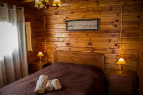 Postel nebo postele na pokoji v ubytování xisto camping