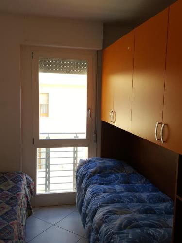 מיטה או מיטות בחדר ב-#voglioandareadalghero