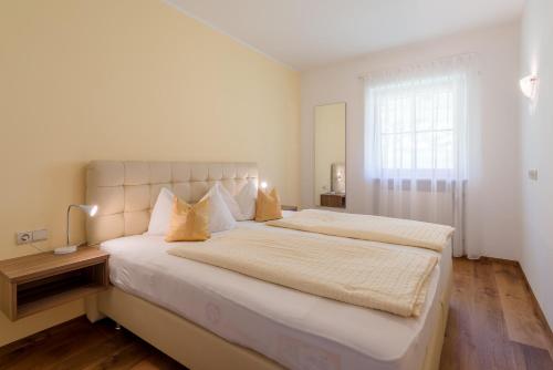Cama o camas de una habitación en Ferienwohnungen Zwerger Reinhold