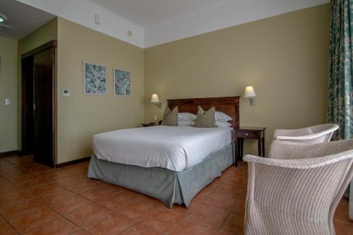 Postel nebo postele na pokoji v ubytování Hotel Cardoso