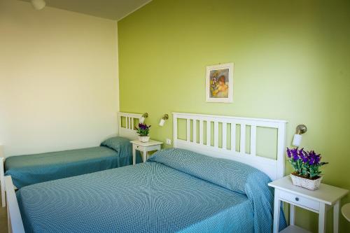 Postel nebo postele na pokoji v ubytování B&b Noto beach