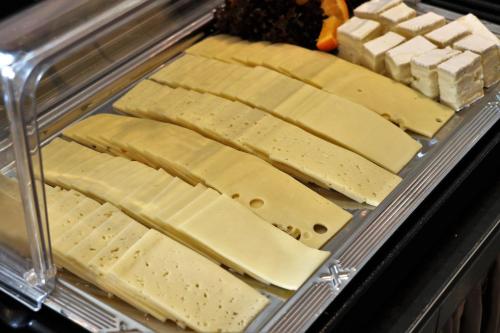 a tray of cheese and crackers in a display case at Hotel Excelsior Dortmund Hauptbahnhof in Dortmund