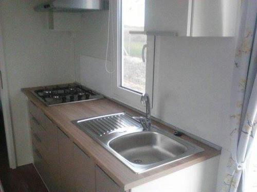 a small kitchen with a sink and a window at VILLAGGIO degli ANGELI SCERNE PINETO in Scerne