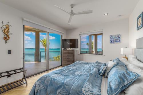 a bedroom with a bed with a view of the ocean at Nirvana Shores in Stuart
