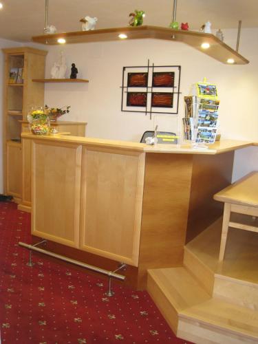an island in a kitchen with a counter top at Lärchenhof Serfaus in Serfaus