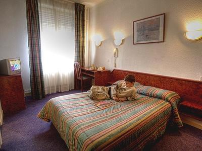 Кровать или кровати в номере Hôtel de Nevers