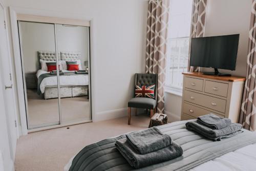 Ένα ή περισσότερα κρεβάτια σε δωμάτιο στο Cavendish House with Secure, Allocated Parking, 2 mins walk from Windsor Castle