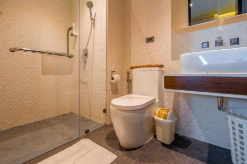 a bathroom with a toilet and a sink and a shower at Naiharn Relife by Nataly in Nai Harn Beach