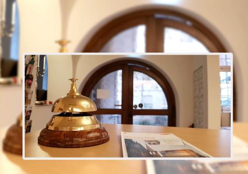 a bell sitting on top of a table at Hotel Bürgerhof in Cologne