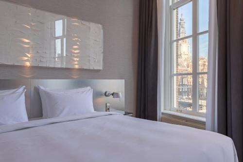 Ένα ή περισσότερα κρεβάτια σε δωμάτιο στο Radisson Blu Hotel, Amsterdam City Center