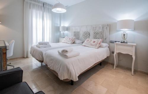 מיטה או מיטות בחדר ב-Apartamento Sueño de la Caleta