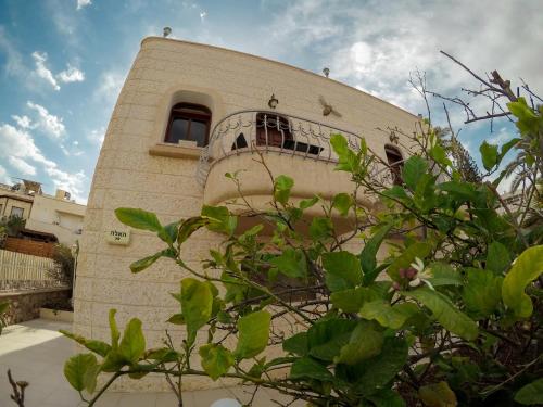 
a large building with a large window at Exodus Hostel & Dive Center in Eilat
