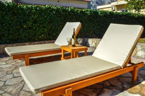 two benches sitting next to each other on a patio at DC Apartment D in Kotor