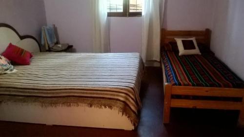 A bed or beds in a room at La Posada de Bartola