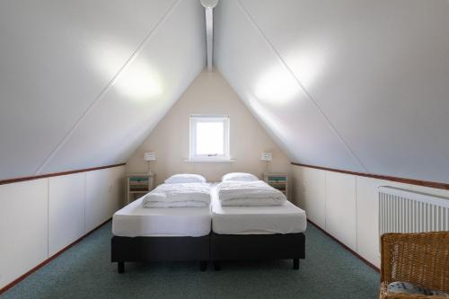 Un pat sau paturi într-o cameră la T Fiskersplak