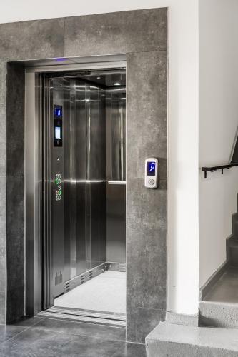 an elevator in a building with its door open at G Suites Luxury Rentals in North Nicosia