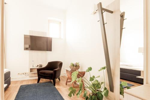 TV a/nebo společenská místnost v ubytování Denner Hotel