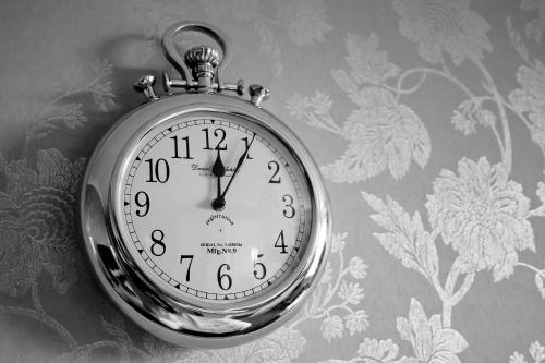 a clock is hanging on a wall at Stirk House Hotel in Clitheroe
