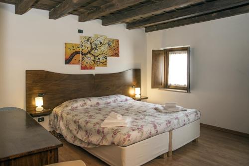 En eller flere senge i et værelse på Residence Villa Vinco