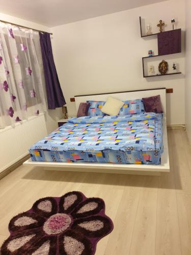 Ένα ή περισσότερα κρεβάτια σε δωμάτιο στο Apartament Oana's Home