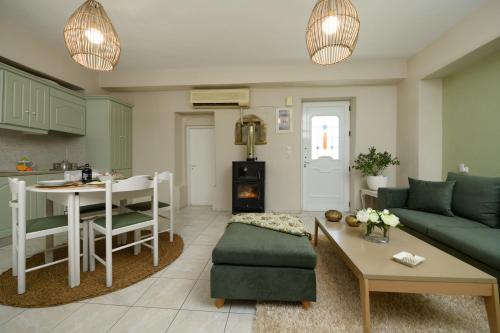 a living room with a couch and a table at Kouses Estate close to Matala, Komo beach & Faistos in Kousés