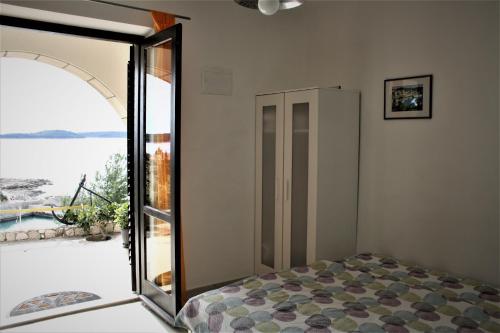 Ένα ή περισσότερα κρεβάτια σε δωμάτιο στο Villa Marijam