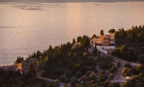 an aerial view of a house on an island in the water at Ble on Blue in Athanion