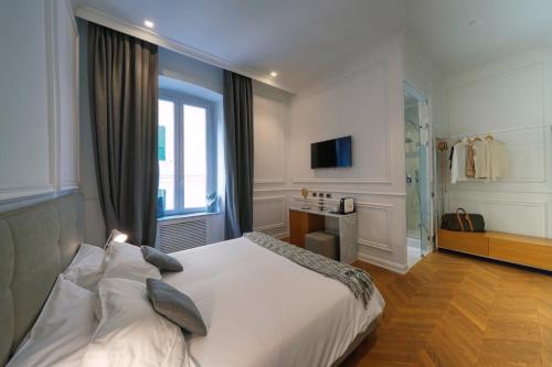Postel nebo postele na pokoji v ubytování Via Chiodo Luxury Rooms