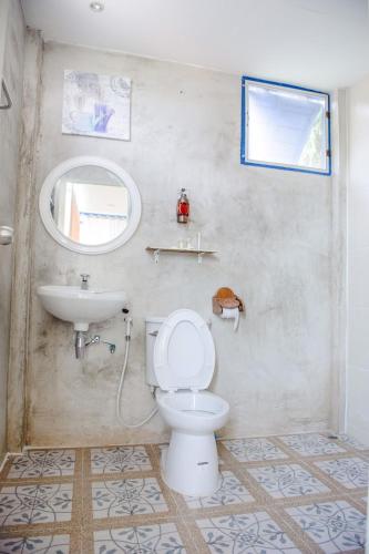 a bathroom with a toilet and a sink at MontView Koh Chang in Ko Chang