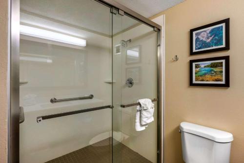 a glass shower in a bathroom with a toilet at Comfort Inn Ocala Silver Springs in Ocala