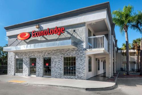 a building with a sign on the side of it at Econo Lodge Airport - RJ Stadium in Tampa