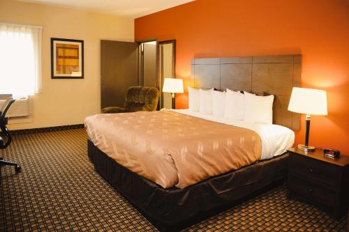 A bed or beds in a room at Quality Inn & Suites Ames Conference Center Near ISU Campus