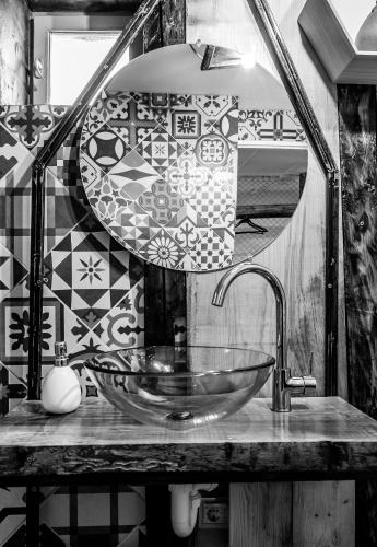 a bathroom with a sink and a mirror at Apartament Art Cluj in Cluj-Napoca
