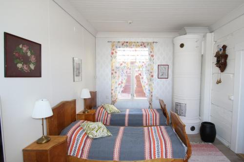 เตียงในห้องที่ Pikisaari Apartment