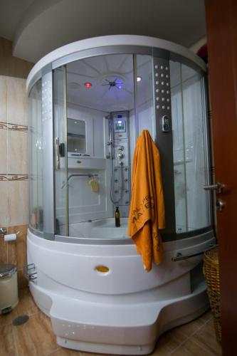a bathroom with a shower with a glass enclosure at Nature Villa in Panayía