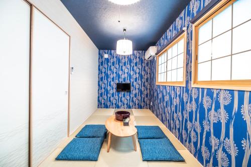a room with blue walls and blue rugs at KYOSTAY Iroha Toji Main in Kyoto