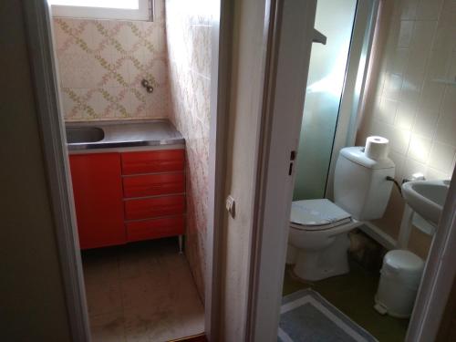 a small bathroom with a toilet and a sink at Ermionida in Kranidi