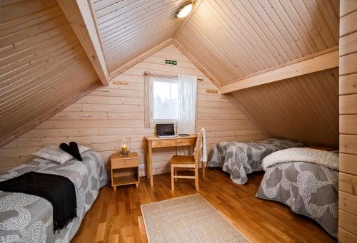 Postel nebo postele na pokoji v ubytování Luoman Hirvimökit