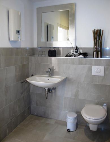 a bathroom with a sink and a toilet at Mosel - River - Quartier 31 in Lieser