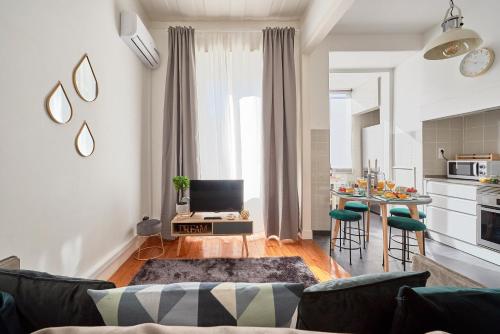 a living room with a couch and a table at Casa Portuguesa Chiado 25 in Lisbon