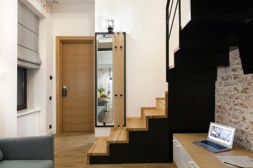 a hallway with a stairway leading to a house at Ribas Rooms Ferenc Lviv in Lviv