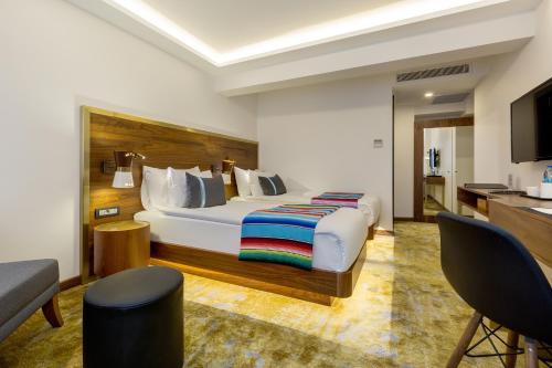 Säng eller sängar i ett rum på Hay Hotel Alsancak