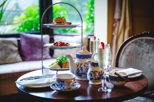 a table with plates of food and cups on it at Aherlow House Hotel & Lodges in Aherlow