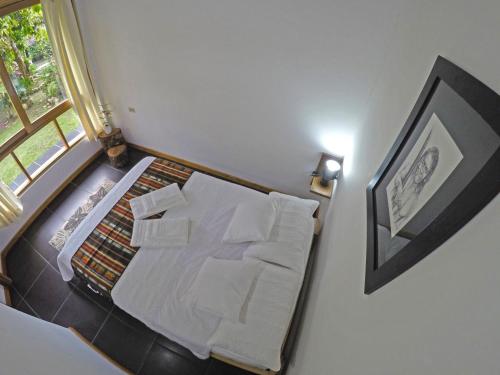 Postel nebo postele na pokoji v ubytování TAGUA LODGE