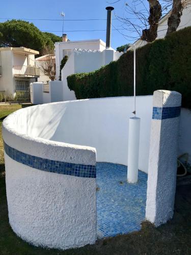 a white wall with blue tiles on it at Residencia Beach in Cambrils