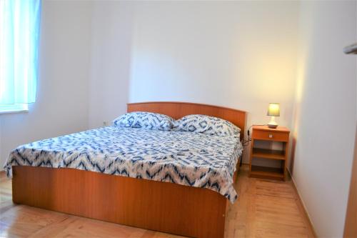 Postel nebo postele na pokoji v ubytování Apartment Daniela