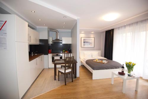 Kuchyň nebo kuchyňský kout v ubytování Kraków Apartments - Friedleina Studio Apartments