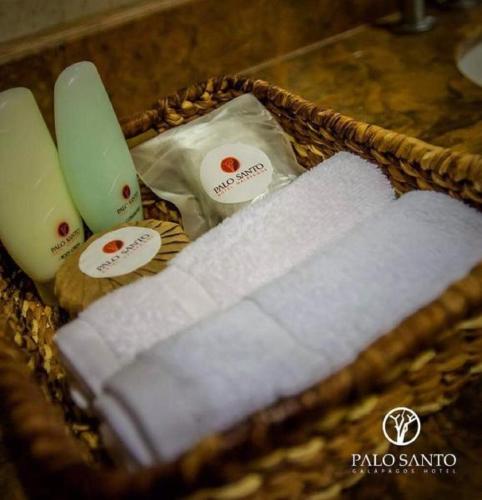 a wicker basket filled with towels and other items at Palo Santo Galápagos Hotel in Puerto Ayora