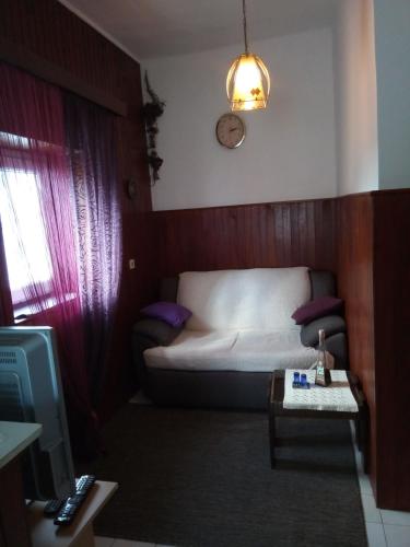 a living room with a bed and a tv at Holiday home "Goga" ruralna kuća in Drniš