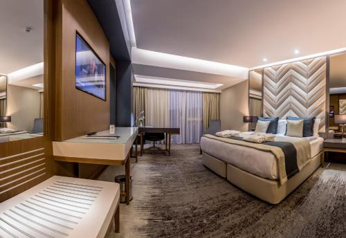 Ένα ή περισσότερα κρεβάτια σε δωμάτιο στο Willmont Hotel